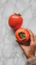 Midsection of man holding strawberry