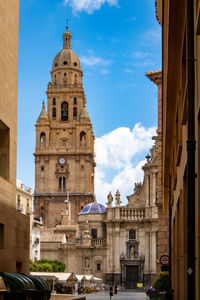 Buildings in city against sky