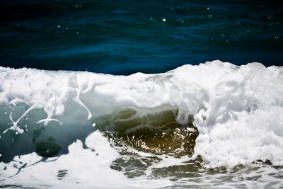 Close-up of wave splashing on shore