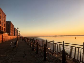 Scenic view of sea against clear sky during sunset