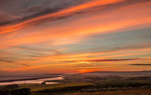 Scenic view of dramatic sky during sunset