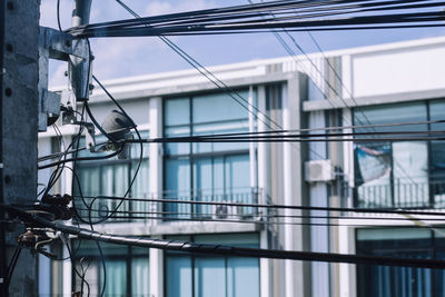 Cables against building in city