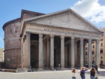 Group of people in front of historical building