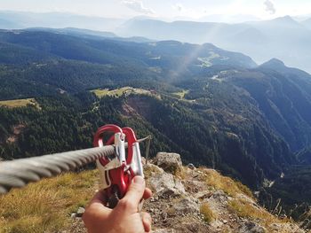 Person on mountain with climbing equipment