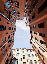 Low angle view of buildings in city against sky