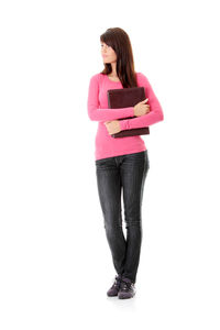 Full length portrait of woman standing against white background