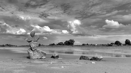 Scenic view of sea against cloudy sky