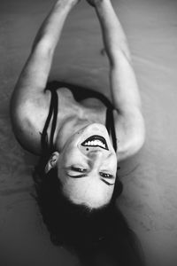 Portrait of smiling young woman in lake