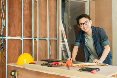 Portrait of man working on table