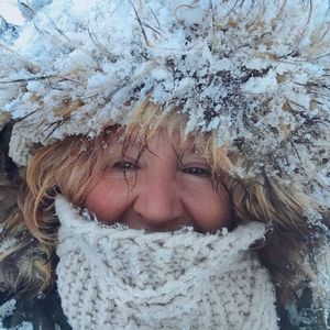 Portrait of young woman in snow