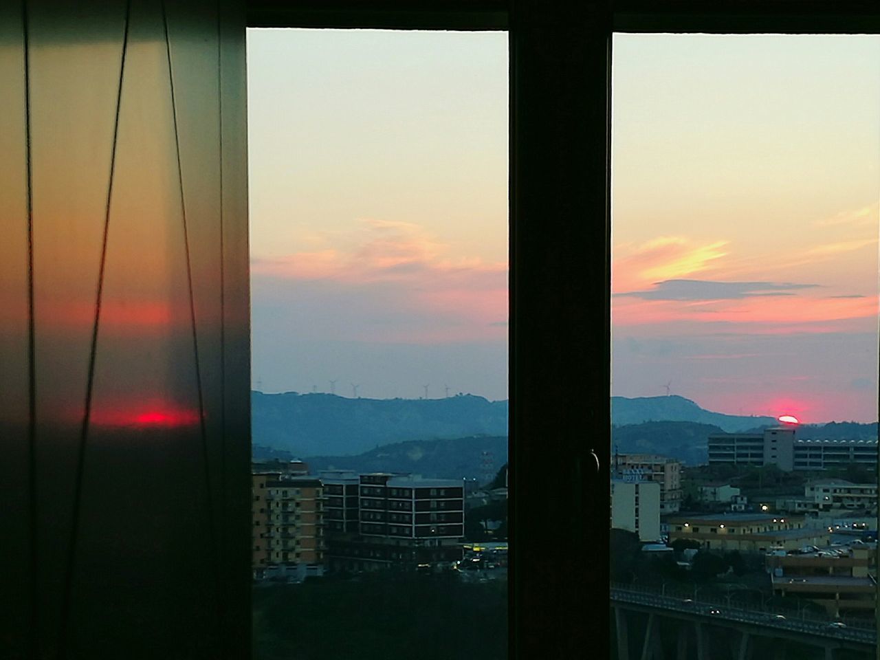 CITYSCAPE AGAINST SKY DURING SUNSET