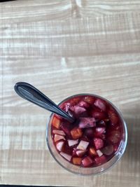 High angle view of strawberries in bowl on table