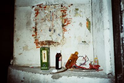 Rusty metal on table against wall