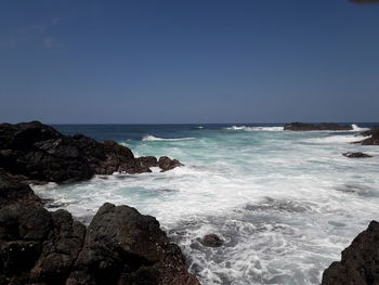 Scenic view of sea against clear sky