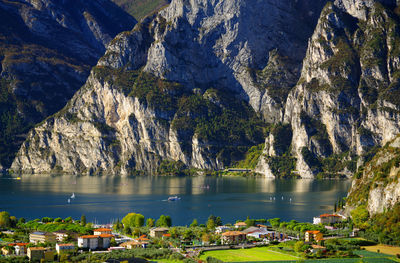 Scenic view of sea by mountains