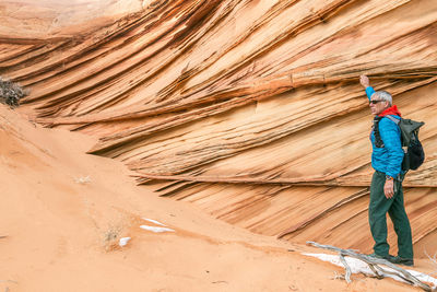 Panoramic shot of man standing on rock