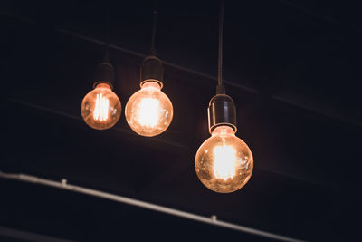 Low angle view of illuminated light bulb