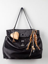 Close-up of bag against white background