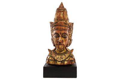 Statue of temple against building