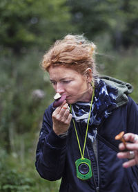 Woman holding wild mushroom