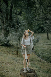 Full length of a man standing in forest