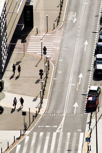 High angle view of people walking on road