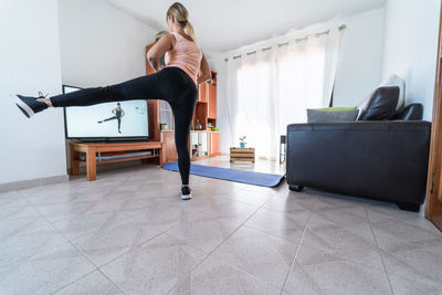 Woman jumping at home