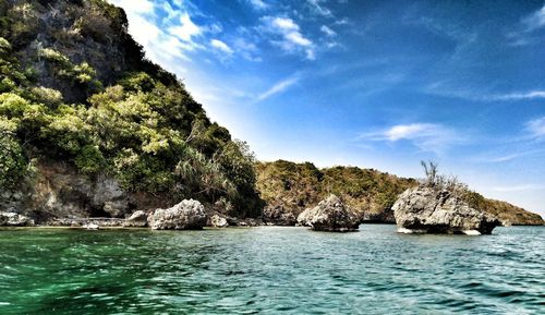 Scenic view of sea against rocks