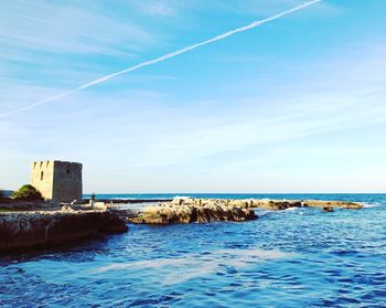 Scenic view of sea against blue sky