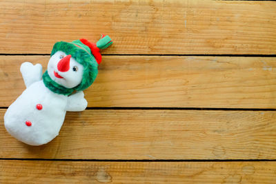 High angle view of stuffed toy on wooden table