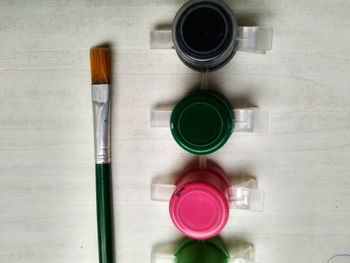 High angle view of various paint on table