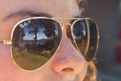 Reflection of man in sunglasses