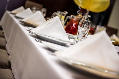 Place setting arranged on dining table at restaurant during wedding ceremony