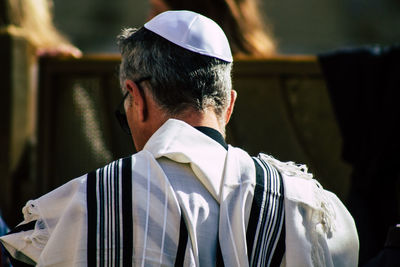 Rear view of man on cross