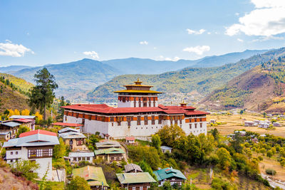 Panoramic view of buildings and mountains against sky