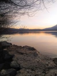 Scenic view of lake against sky during sunset