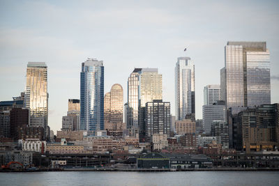 Skyscrapers in city against sky