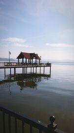 Built structure on sea against sky