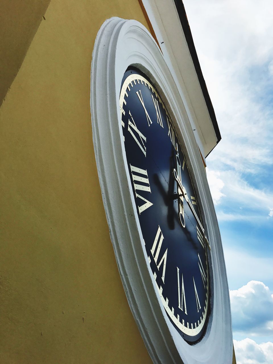 time, clock, minute hand, no people, clock face, close-up, low angle view, roman numeral, hour hand, day, indoors, sky