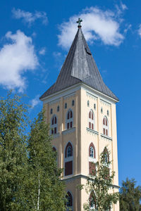 Low angle view of bell tower against sky