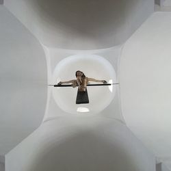 Low angle view of cross sculpture in temple