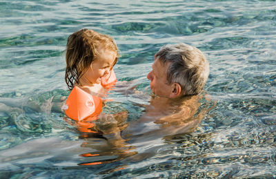 Boy swimming in pool