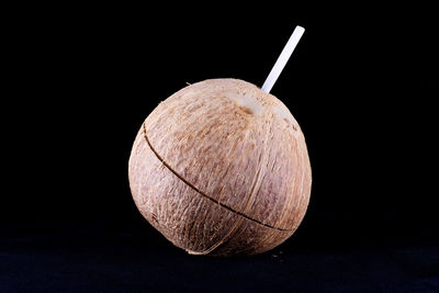 Close-up of apple against black background