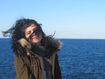 A wonderful day in malta. portrait of woman by sea against sky