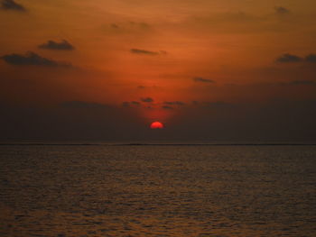 Scenic view of sea against romantic sky at sunset