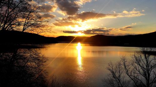 Scenic view of lake against sky during sunset