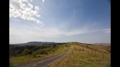 Road passing through field