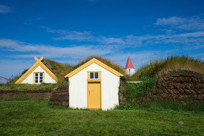 House on field against sky