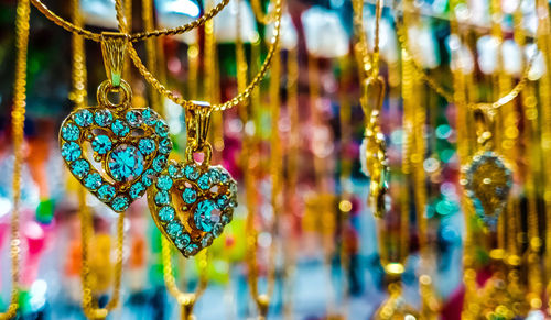 Close-up of ornaments hanging on display at store