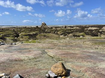 Rock formations on landscape against sky